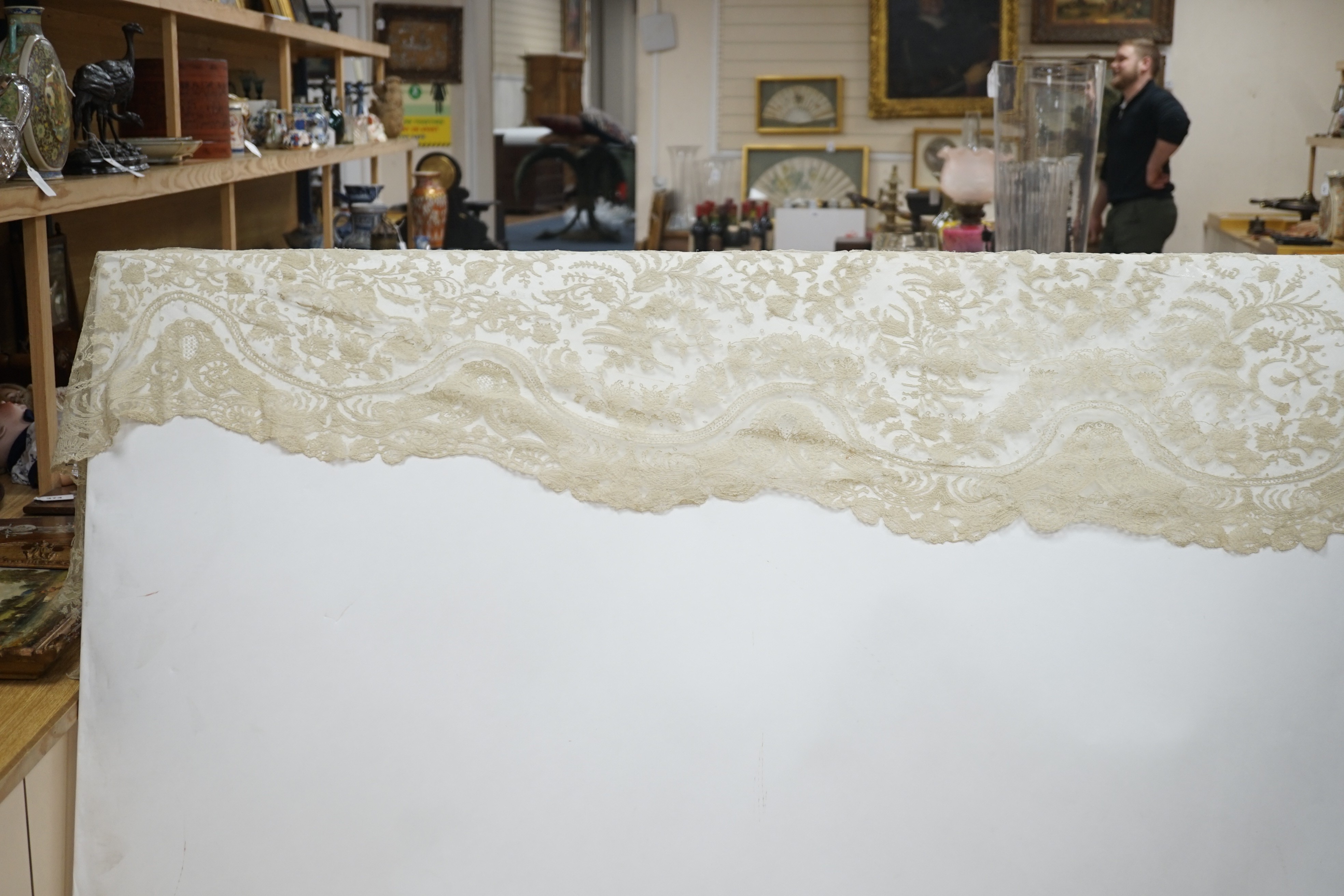 A rare length (9 and a half yards) of Brussels 19th century needle lace, some repairs and damage, circa 1880 and a similar wedding veil